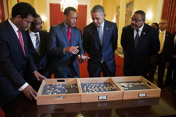 Zeray with President Obama and fossil Lucy