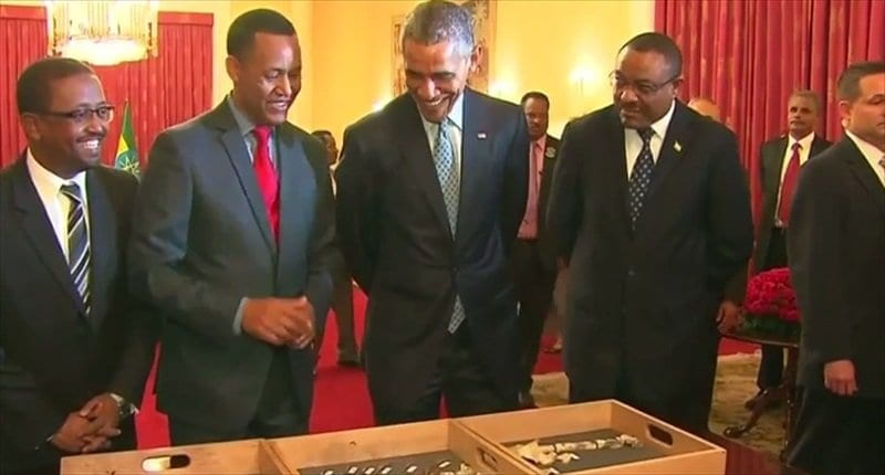 Zeray with President Obama and fossil Lucy