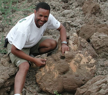 Zeray with fossil elephant cranium